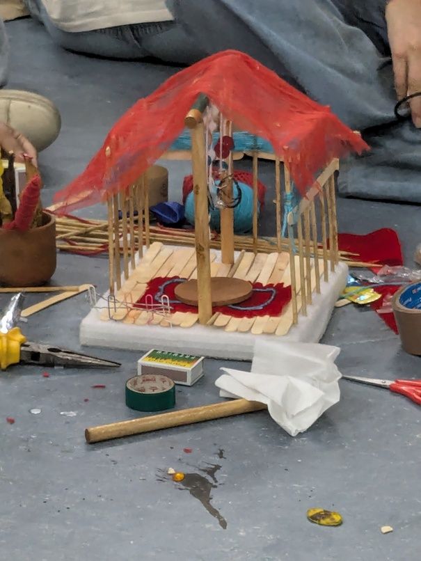 A beautiful doll house made from discarded items
