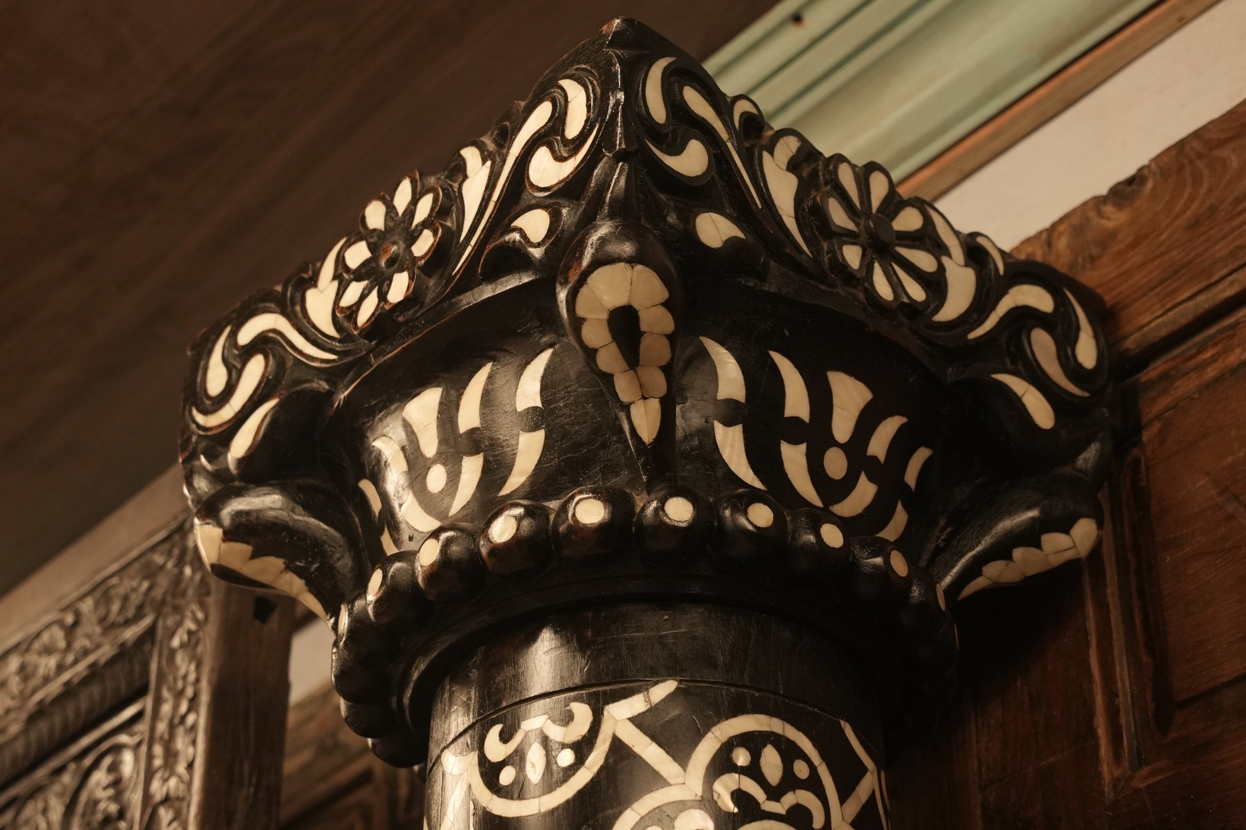 Hand-carved Indian Haveli door made from reclaimed wood, featuring intricate geometric patterns and mother of pearl inlay design.