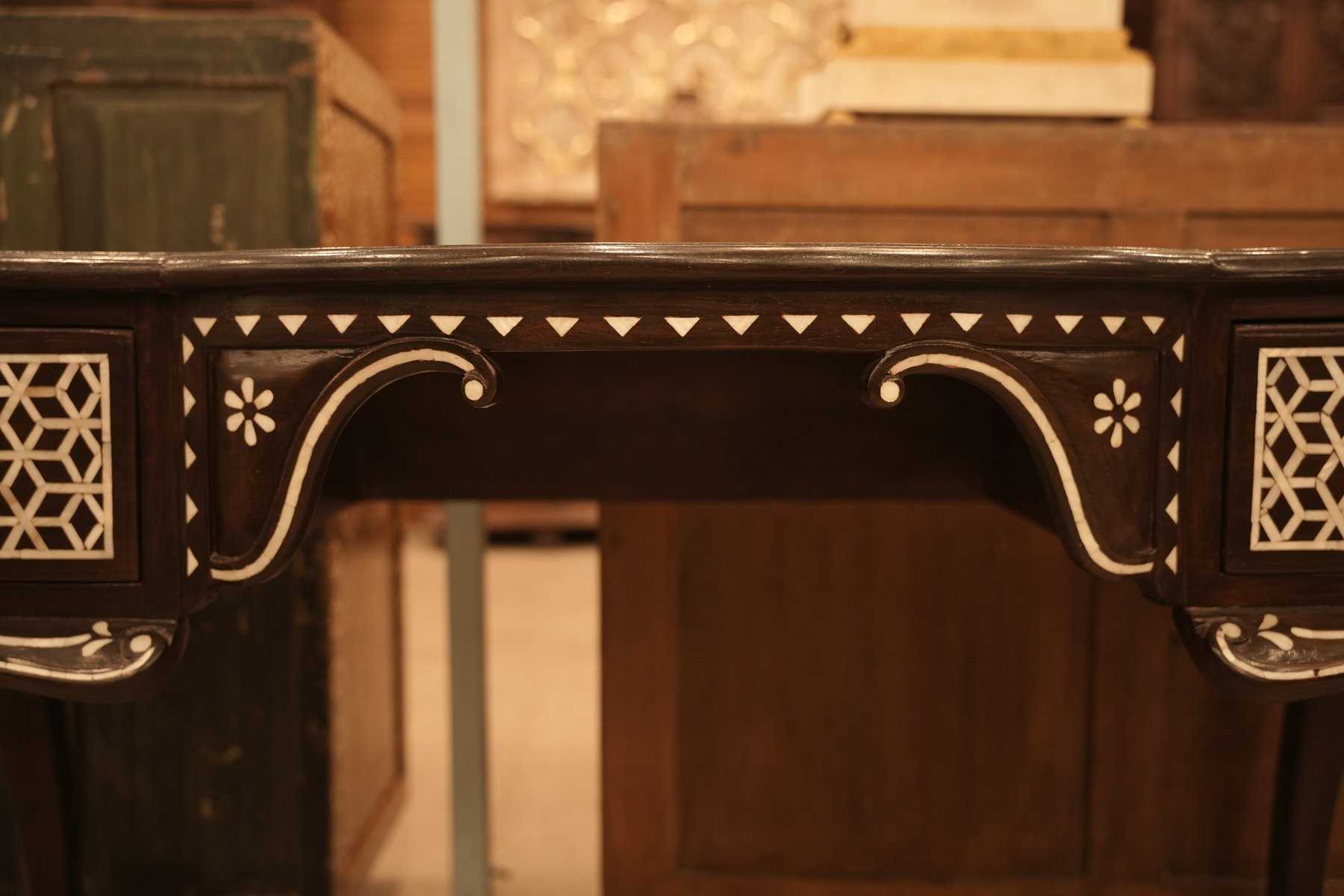Black Anglo-Indian console table with intricate mother of pearl inlay detailing, elegant cabriole legs, and timeless heritage-inspired craftsmanship.