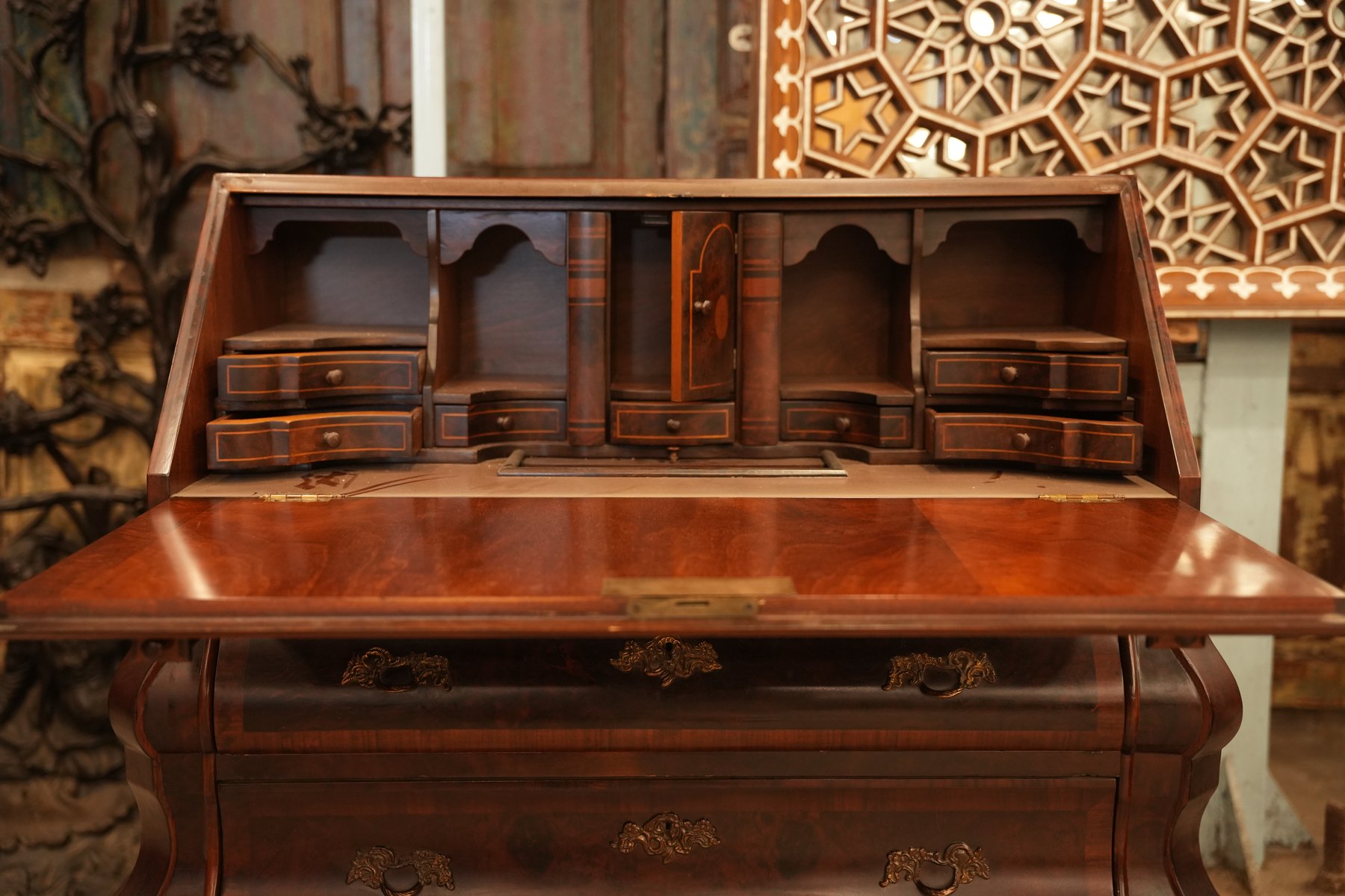 Antique Dutch walnut bombe writing desk with three drawers and a drop-front design, reflecting the elegance of Louis XVI and Baroque craftsmanship.