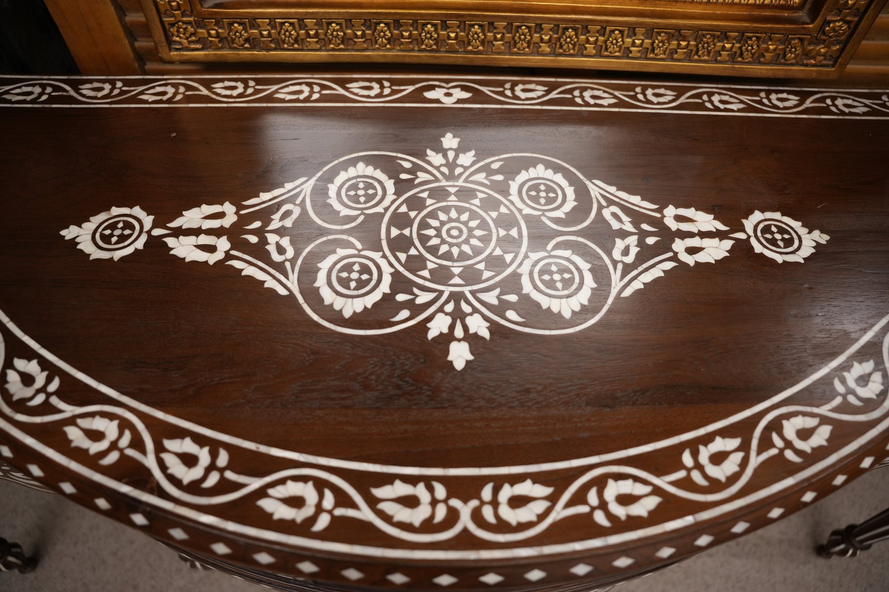 Handcrafted wooden console table featuring exquisite mother-of-pearl inlay, intricate detailing, and timeless elegance.