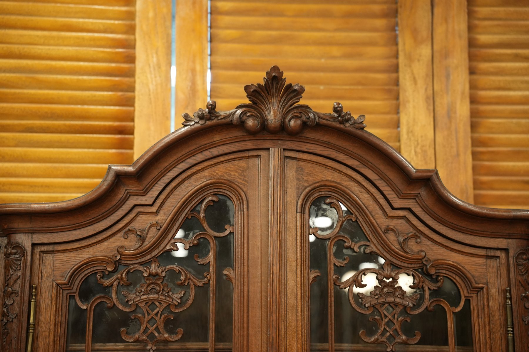 Louis XV Liege-style bookcase/vitrine with elegant curves, glass display doors, and refined French craftsmanship.