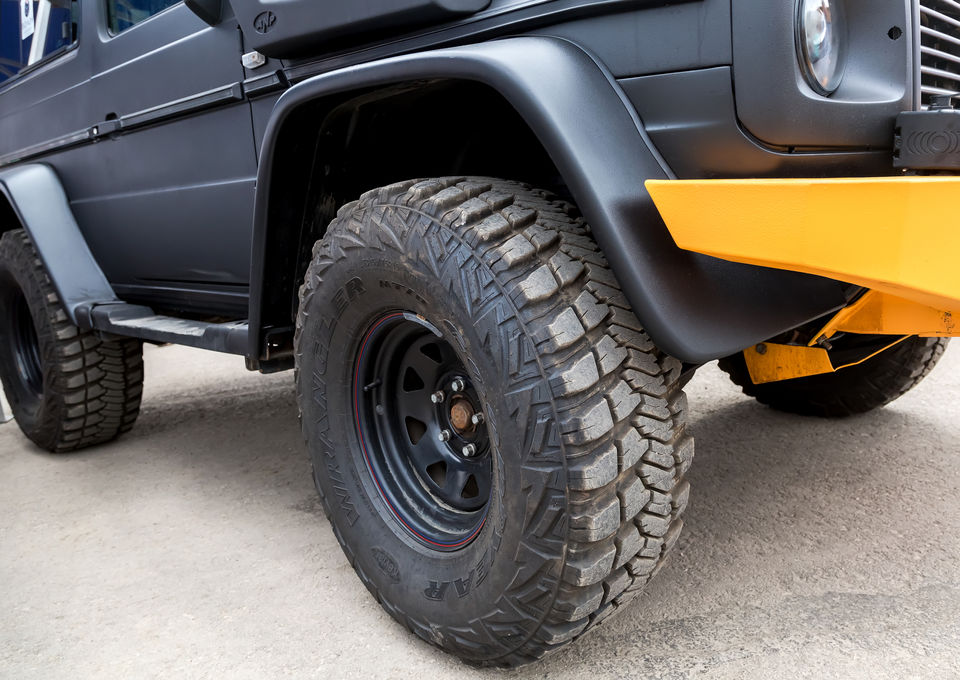 Big tyre mounted on a car