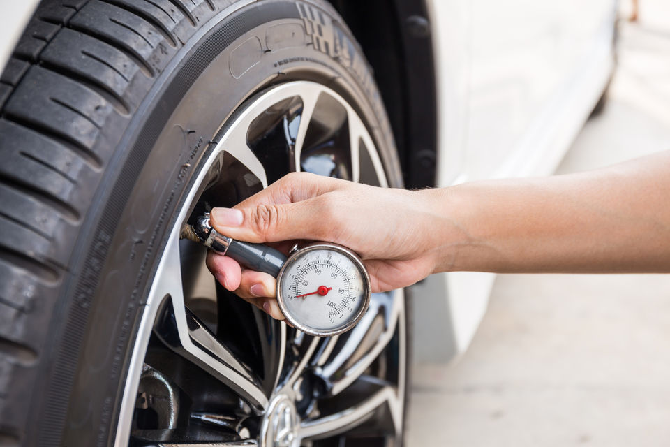 Adjusting tyre pressure before beach or sand driving