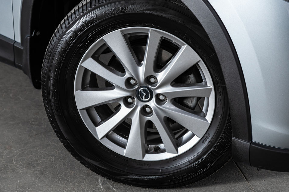 A wheel and a tyre securely attached to the car's axle