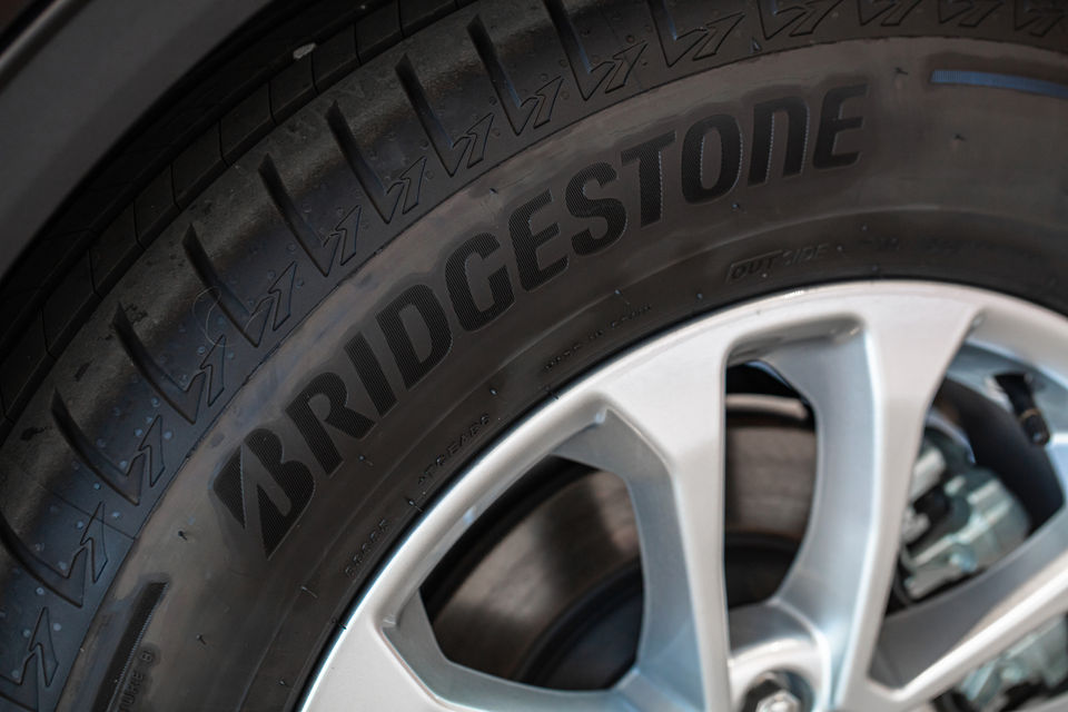 A tyre with a Bridgestone logo displayed on its sidewall