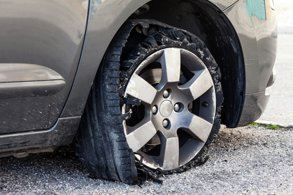 Shredded tyre caused by a sudden blowout