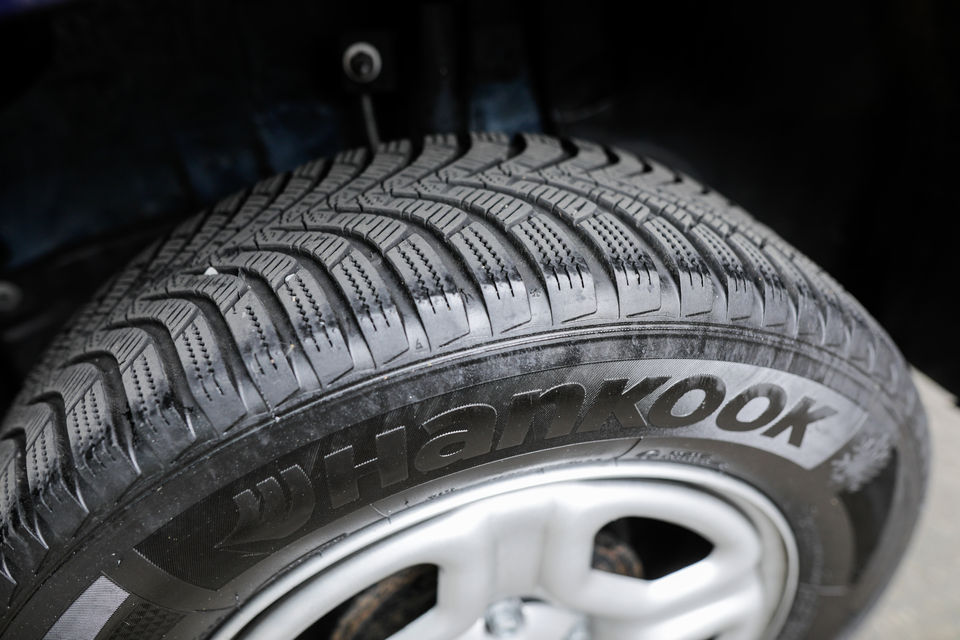 A detailed shot of a Hankook tyre mounted on a vehicle