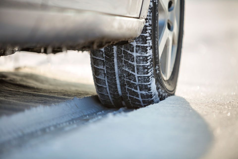 Tyre on a snow-covered road during winter