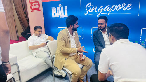 CRMtravel owner in discussion with Anjna Global at their stall during SATTE 2025