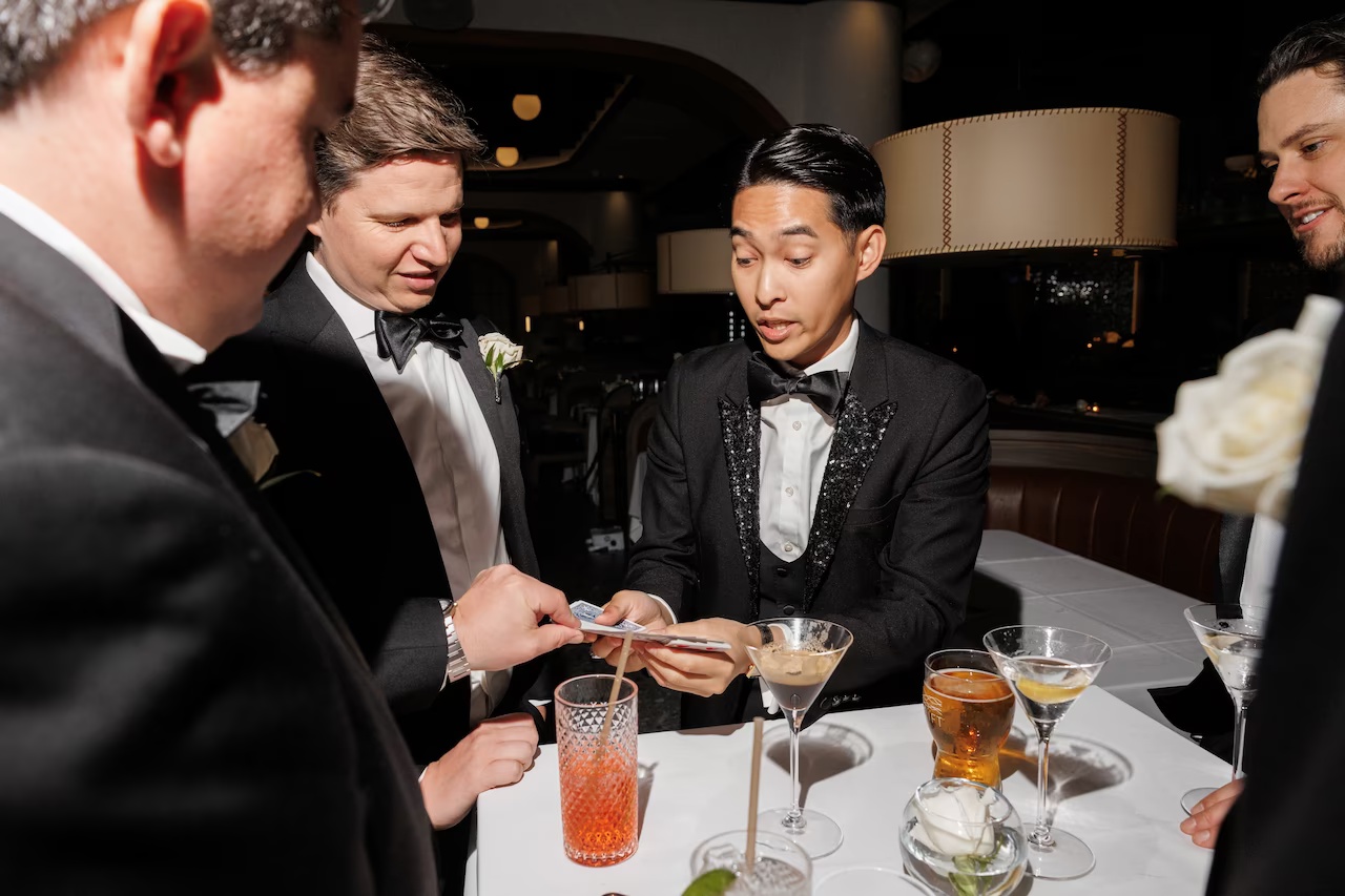 Allen He performing close-up magic at a corporate event