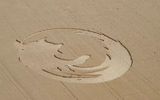 In this photo provided by Oregon State University, students carve crop circles in the shape of the Mozilla Firefox logo in an oat field near Amity, Oregon, on Saturday, August 12, 2006, to celebrate Mozilla Firefox's 200 million downloads.Google, the Internet search company, organized a special satellite flyby so that the 200-foot Firefox logo in the form of crop circles could be shown on Google Earth, which features high-resolution photos from space. (AP Photo/Oregon State University via News-Register)