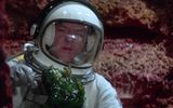 Astronaut holds green slime