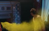 A ghost in the form of yellow smoke flies into the fireplace