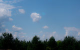 A bright object in the center of the frame is a scratch on the tinted glass of the car (through which was removed from the landscape). The blur turned out due to the focus on the background, and the color correction due to the white balance, expose for the clouds.
Translated by «Yandex.Translator»