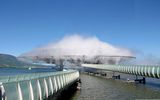 "Misty building" (The Blur Building) is located in Switzerland on lake Neuchatel.

Water is pumped from lake Neuchatel, filtered and served in a fine mist through 35,000 high pressure nozzles. Intelligent weather system reads the changing climatic conditions of temperature, humidity, speed and wind direction and regulates water pressure in different areas. When entering Blur, visual and acoustic reference points erased. There is only an optical "white noise" and "white noise" of pulsing nozzles.

Inside there is a fascinating acoustic environment of Christian Markle. Lightweight design Tensegrity has dimensions of 300 feet wide, 200 feet deep and 75 feet in height and supported by four columns.
Translated by «Yandex.Translator»