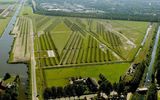 But Schiphol, located in a valley, has no natural hills or around other denoising of natural objects. In order to solve this problem the airport management turned to the team of engineers, architects and designers. The result of their collaboration was a unique Park built to the South-West of the airport.

A series of artificial hills with a height of 2 meters arranged in such a way that they dampened the noise waves coming from the runways. Engineers have calculated the optimum distance between hills for effective acoustic absorption, which reached 10 meters, and the total number of such barriers had been erected 150. In addition, there were several water channels, which are also designed to combat the spread of noise over long distances.

Unusual Playground with artificial hills and channels were designed in the form of the Park, which was named Buttshot. Here there are walking and bike paths, planted trees.
Translated by «Yandex.Translator»