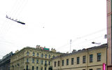 The lights above the street of St. Petersburg. Part of a photo.
Translated by «Yandex.Translator»