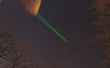 Green laser aimed at the sky.
Translated by «Yandex.Translator»