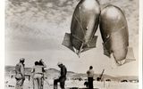 Launch of weather probes before nuclear tests at Indian Springs Air Force Base (Nevada) March 14, 1953These helium-filled "Keaton" balloons are used to obtain information about air pressure, temperature and humidity, as well as other meteorological data during periods of atomic testing at the Nevada test site. They are sent into the air before each nuclear test and descend a few minutes before the actual explosion.In this way, last-minute weather information is relayed from Indian Springs Air Force Base to the Atomic Energy Commission's test manager at the control point. Such data are used to predict the future pathways of radioactive clouds in the atmosphere . "