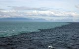 The meeting point of the North Sea and the Baltic Sea near Skagen, Denmark. The water does not mix because of the different densities.