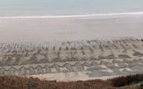 The waves made the piles of stones look like arrows