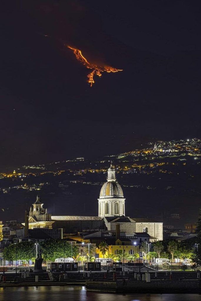 Lava from Mount Etna creates a fiery phoenix in the sky over Sicily