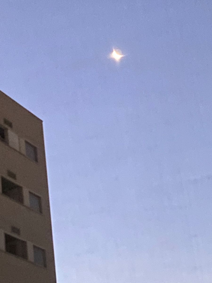 Photo of the moon through a grid (the grid is out of focus).