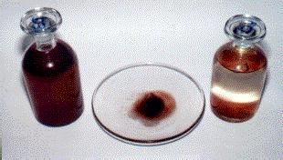 A sample of rainwater (left) and after the particles settled (right). Dried sediment (in the center).