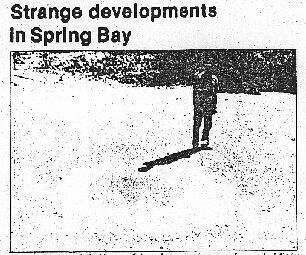 MANITOULIN-RECORDER, WEDNESDAY, OCTOBER 3, 1990.Morris Lanctry stands next to one of two perfectly shaped circles in a gravel pit owned by Ivan Mccoleman, a resident of Spring Bay. Two circles with a diameter of approximately 10 by 10 feet (3 by 3 m) are embedded in the mud. The inside of the circles looks as if they have been swept, except for a spot of dirt in the middle of the circle. The circles were discovered two weeks ago, although no one has been in the area recently. It makes you wonder how or who did the circles?