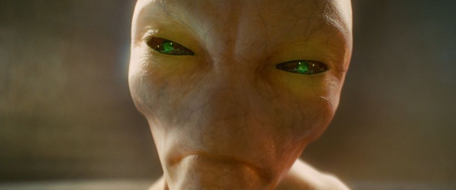 The alien's face close up