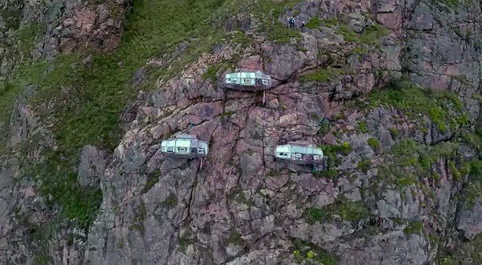 Capsule hotel Skylodge on a cliff in Cusco.

Such hotels are quite common. They can be mistaken for something paranormal, or maybe just the glare from their glasses.
Translated by «Yandex.Translator»