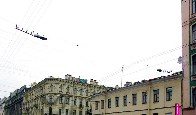 The lights above the street of St. Petersburg. Part of a photo.
Translated by «Yandex.Translator»