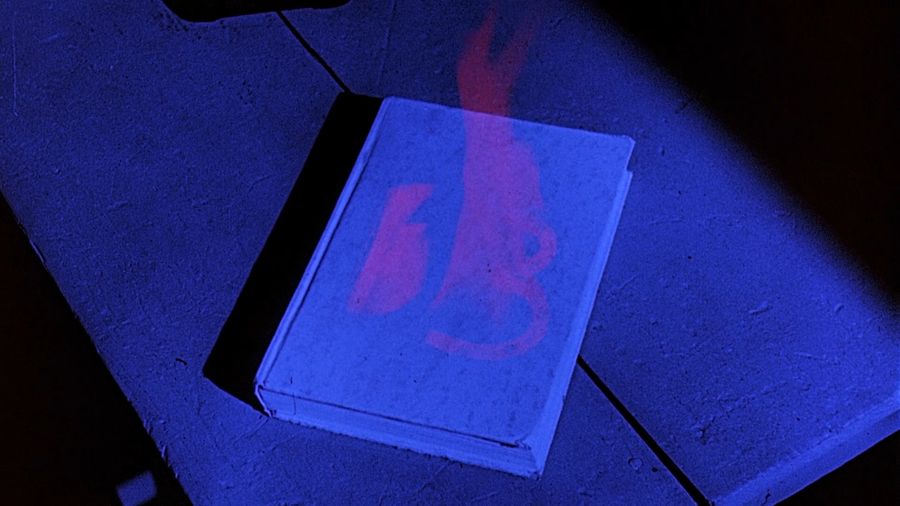 Ghost fire in the form of the number 13 on the cover of the book