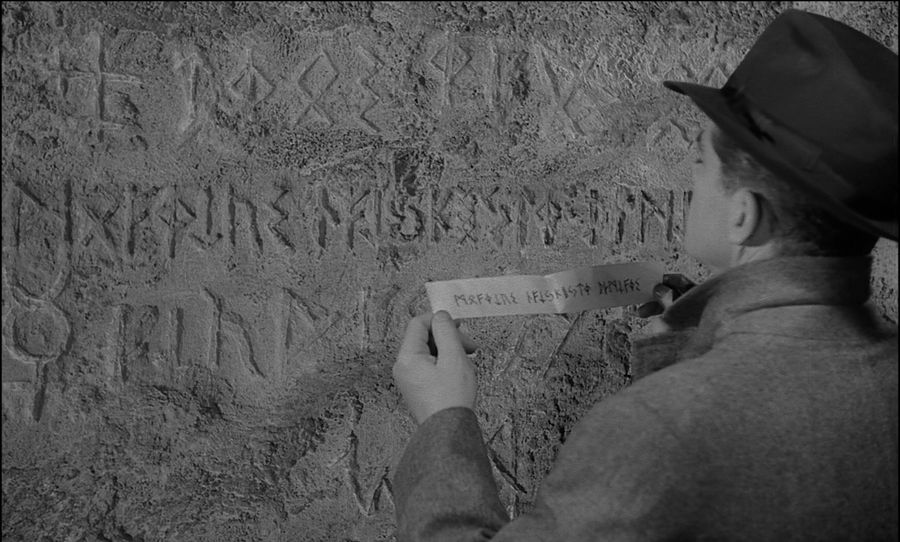 A parchment with runes and an inscription on a Stonehenge stone