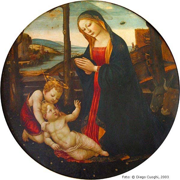 Мадонна с младенцем Сан-Джованнино (La Madonna con Bambino e San Giovannino), выставленная в Зале Геркулеса в Палаццо Веккьо во Флоренции. На этикетке музея написано Jacopo del Sellaio, но в записи каталога (номер 00292620) мы читаем, что картина скорее принадлежит Себастьяно Майнарди (1466-1513), художнику кружка Гирландайо, работавшему во Флоренции в конце 15-го века.

Уфологи видят в сцене вверху справа, за плечами Мадонны, свидетельство "близкого контакта" с неопознанным летающим объектом. Там мы видим персонажа, который, положив руку на лоб, смотрит на НЛО в небе. С ним собака, и животное тоже смотрит в сторону странного предмета.

Можно было бы подумать, что это Звезда Рождества, но ее мы видим в левом верхнем углу в сопровождении трех других маленьких звезд или языков пламени (частое изображение в подобных картинах).

Так что же это? На многих картинах с этим сюжетом мы видим такую же сцену: Ангел выходит из темного облака, внутри которого сияют золотые лучи, и, совсем как на картине в Палаццо Веккьо, за сценой наблюдает пастух, который держит руку на лбу. При этом ангел является пастухам выглядывающим из своего рода ослепительной щели в небе. В "Мадонне с Младенцем" Сан-Джованнино мы видим именно этот яркий проблеск в центре облака, который и принимают за НЛО. Например, Vincenzo Foppa, Bernardino Luini


Три маленькие звезды, которые на этой картине сопровождают большую звезду Рождества, часто использовались для обозначения тройственной девственности Марии; пастух, который смотрит на явление в небе, прикрывая глаза рукой, похож на многие другие штрихи с картин того же сюжета; светящееся облако происходит из истории Рождества в апокрифическом протоевангелии Иакова.

