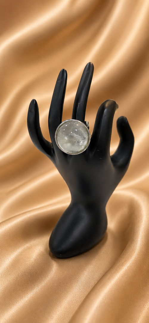 Clear quartz ball set in metal.
