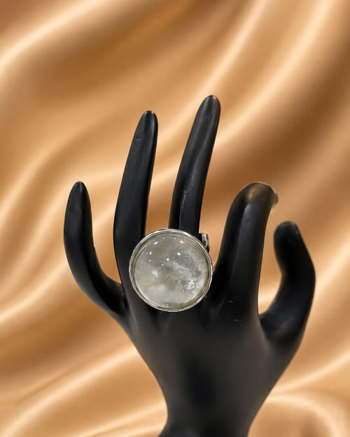 Clear quartz ball set in metal.