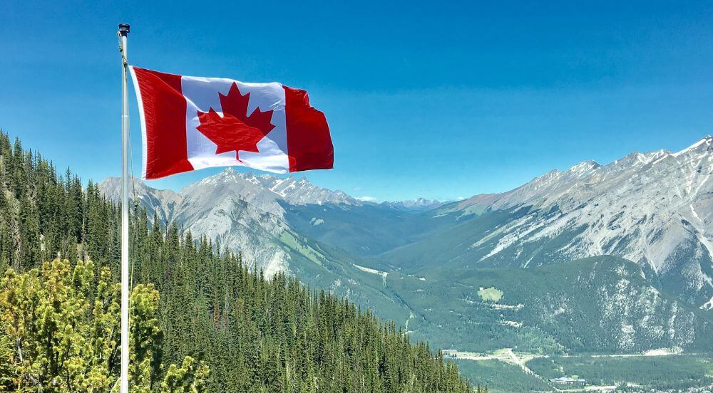 Canadian flag in the mountains