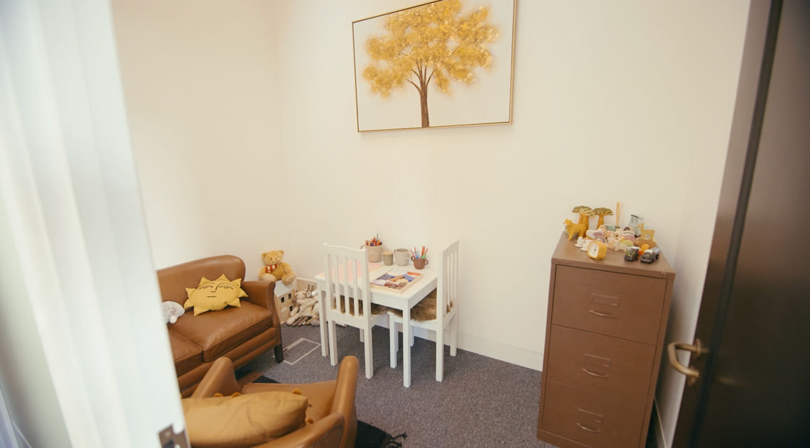 Affiniti+ child therapy room with child-sized table, seating and play materials.