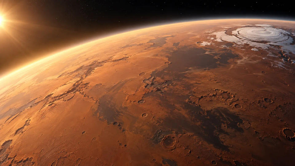 Orbital view of Mars with a bright polar ice cap and a thin sunlit atmosphere