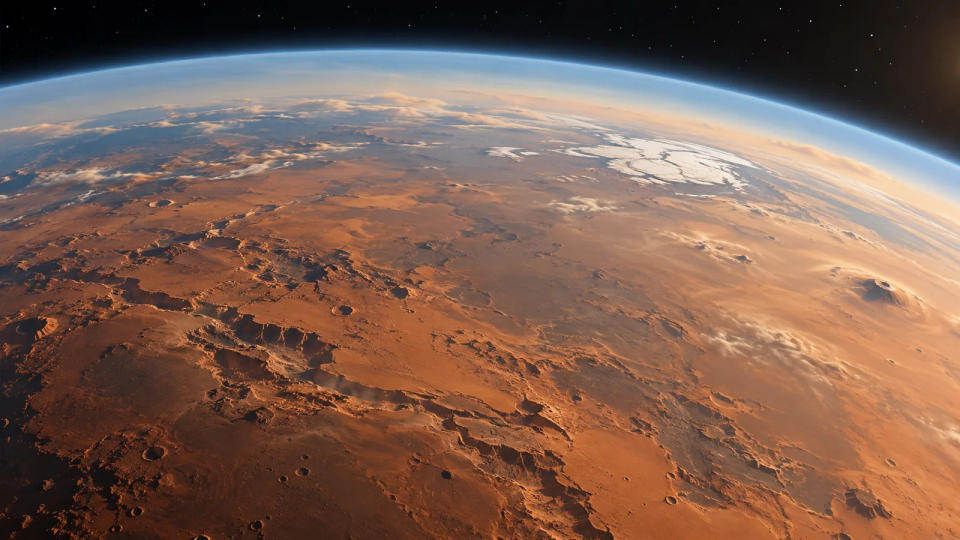 Mars seen from orbit with a thin glowing atmosphere above rust-colored terrain and polar ice.