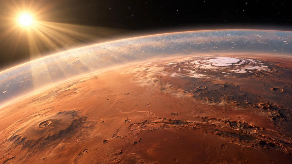 Orbital view of Mars with sunlight illuminating a thin atmospheric haze representing engineered heat-trapping particles