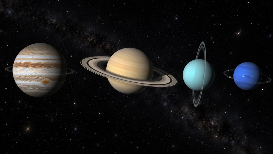 Jupiter, Saturn, Uranus, and Neptune shown together with their very different ring systems