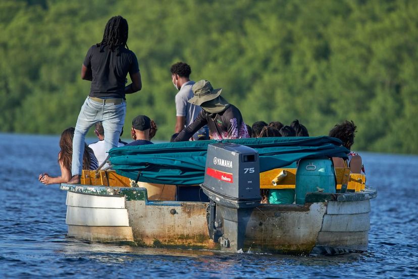 beautiful shot of a floating boat in a river beautiful shot of a floating boat in a river