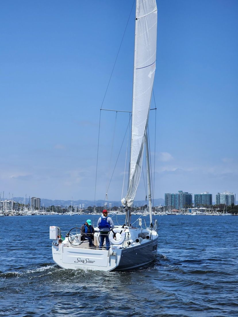 Sailing in Marina del Rey, boats on the water with cityscape in the background. Sailing in Marina del Rey, boats on the water with cityscape in the background.
