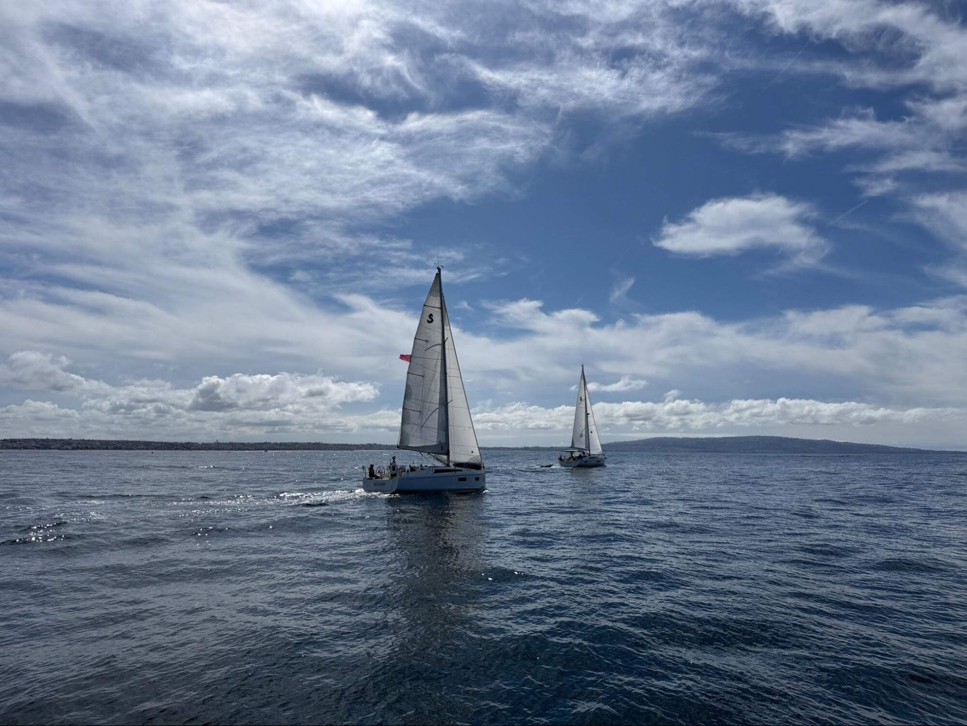 Two vessels approaching in a crossing situation on open water.