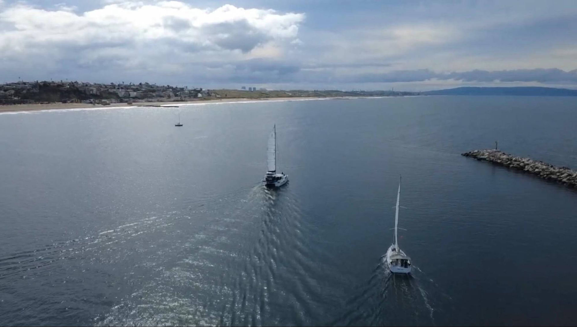 Sailing vessel interaction showing overtaking and crossing awareness.