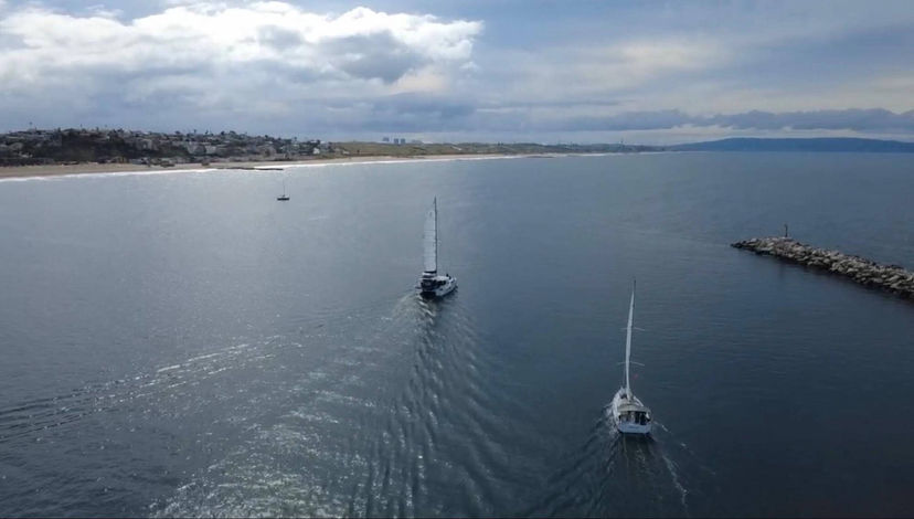 Sailing vessel interaction showing overtaking and crossing awareness.