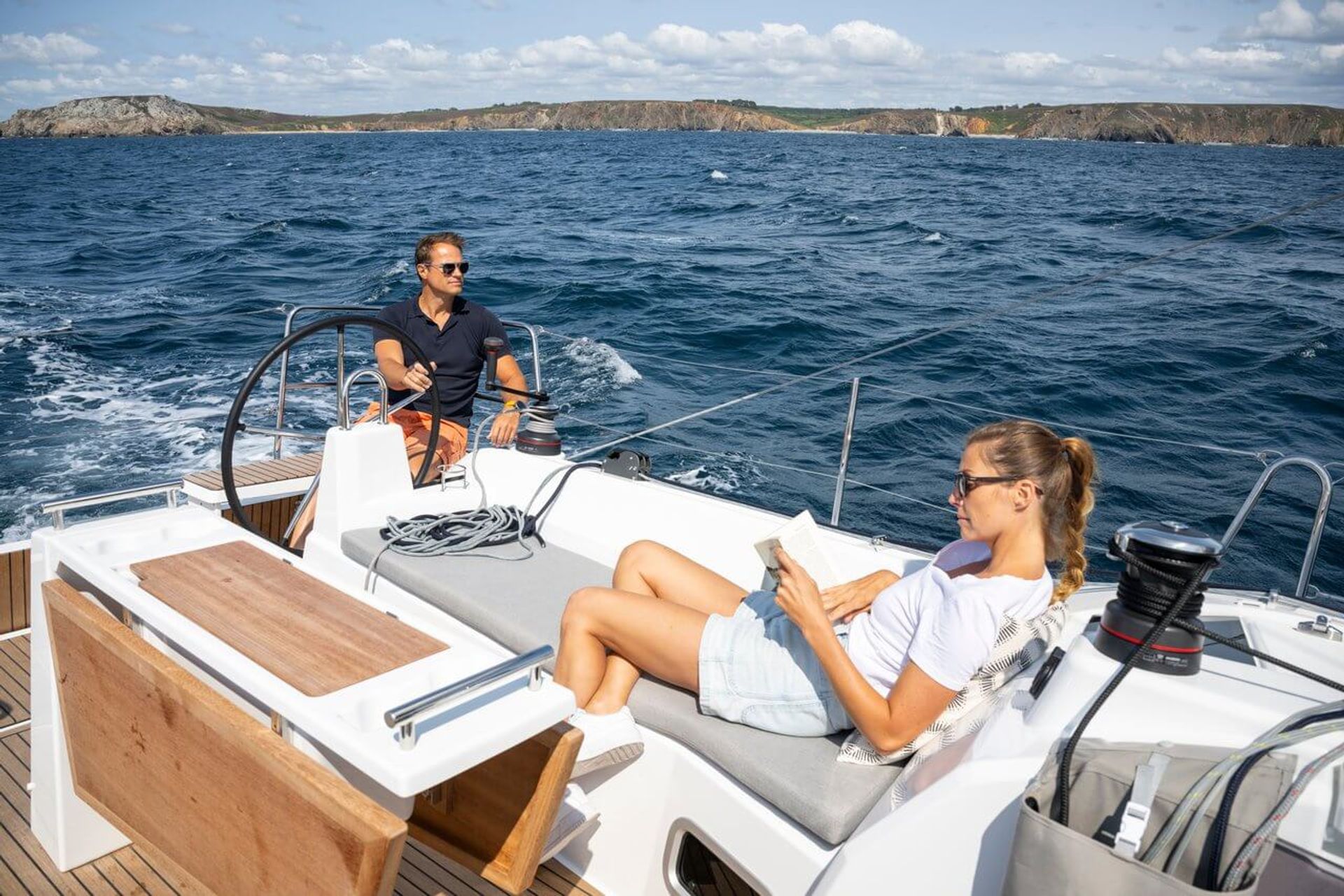 Oceanis 371 sailboat lifestyle image showing coastal cruising experience